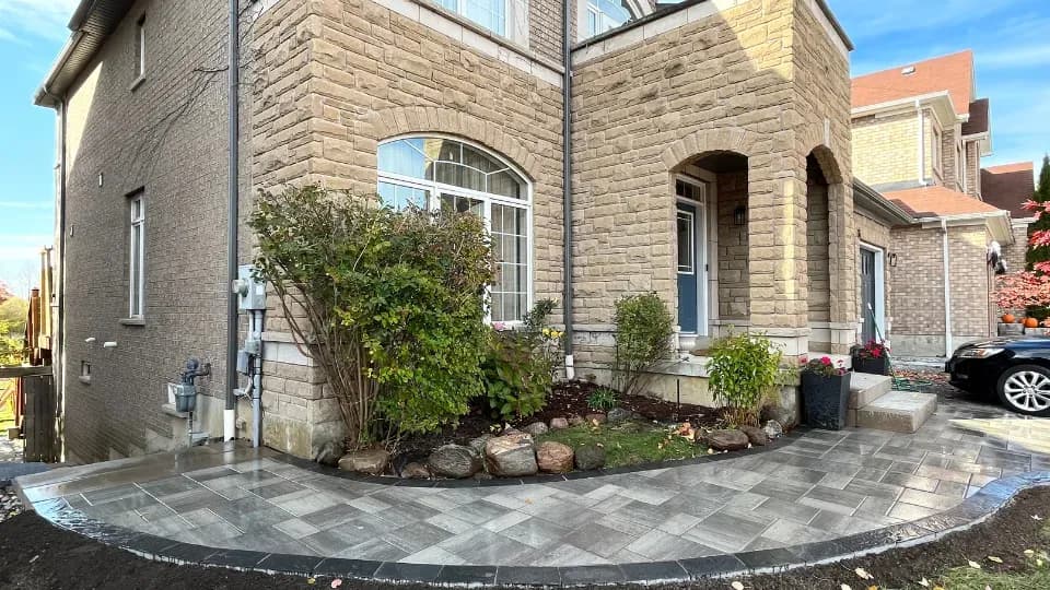 Completed patio area with retaining wall backdrop