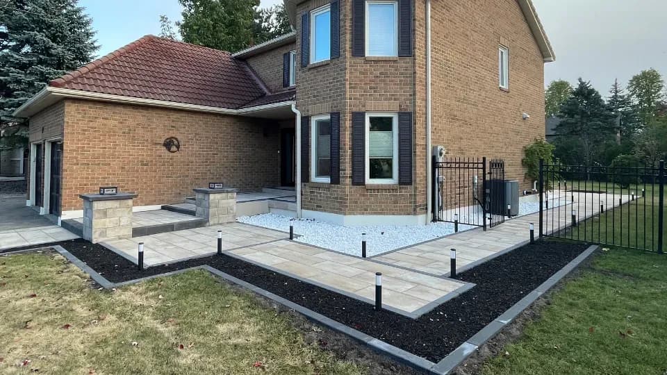 Stunning interlocking driveway with natural stone borders